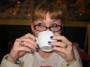 Melissa Bezner drinking a cappuccino